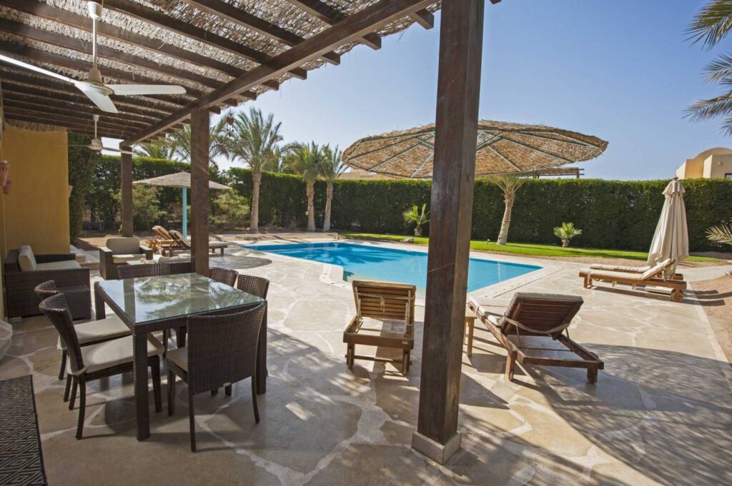 Image of pool side lounge with outdoor ceiling fans